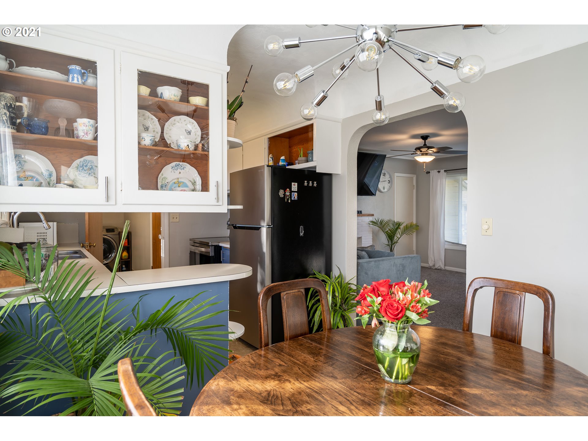 1367 Olympic Street Springfield, OR 97477 - Photo 6 of 20 a living room with furniture and flowers