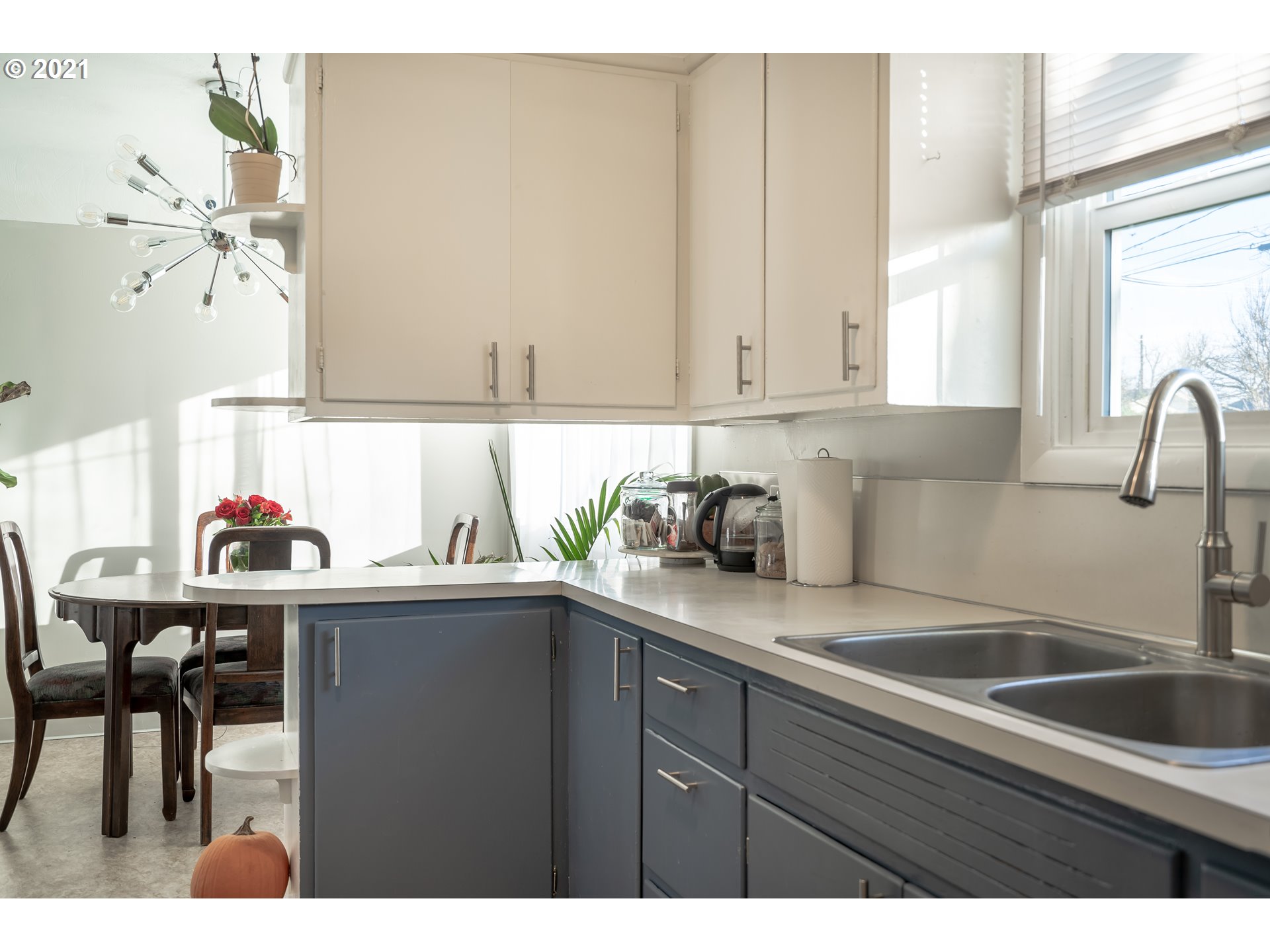 1367 Olympic Street Springfield, OR 97477 - Photo 9 of 20 a kitchen with a sink cabinets and window