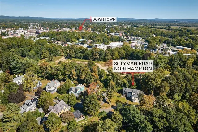 a kitchen with stainless steel appliances kitchen island granite countertop a refrigerator and microwave