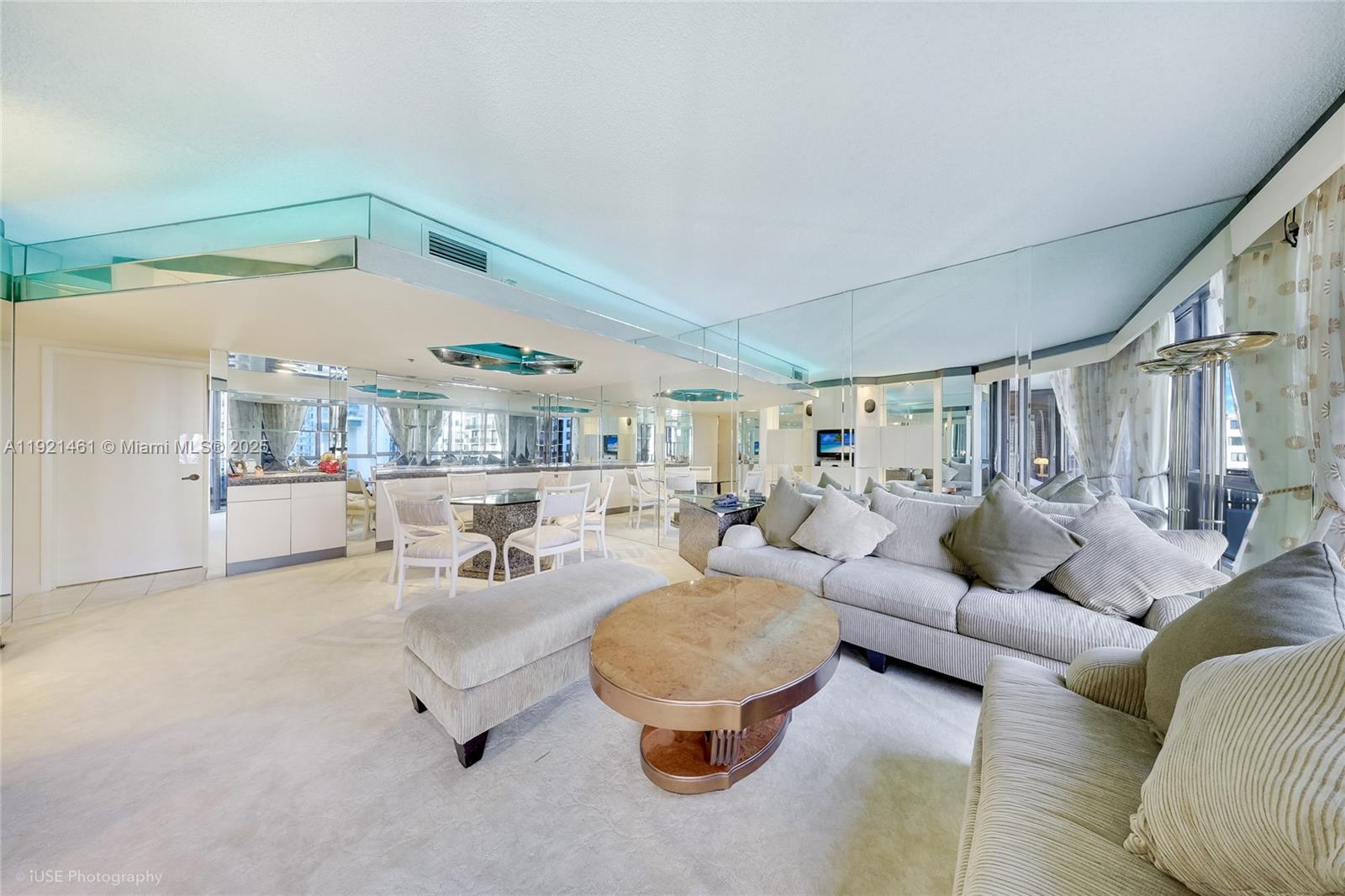 520 Brickell Key Drive, Unit A1510 Miami, FL 33131 - Photo 4 of 15 a living room with furniture and a large window