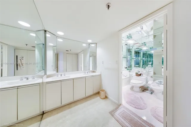 a bathroom with a double vanity sink and mirror