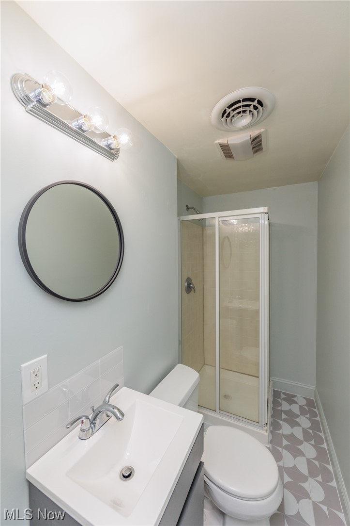 355 Dellwood Road Avon Lake, OH 44012 - Photo 30 of 35 Bathroom with a shower with door, tile floors, toilet, and vanity