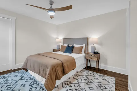 a bedroom with a bed and a dresser