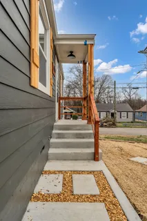 a view of staircase with a rug