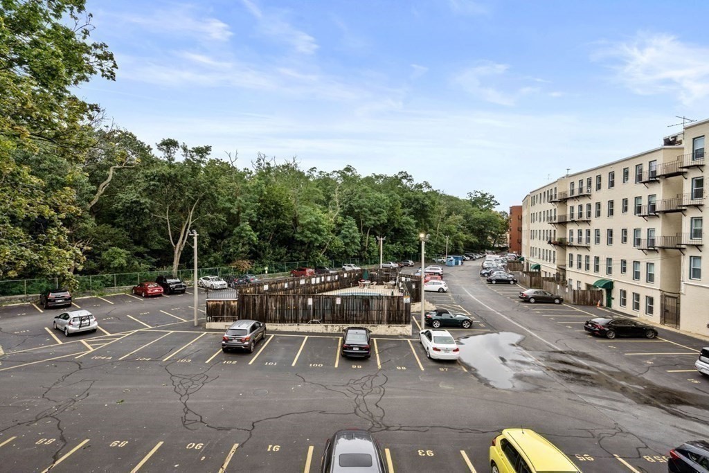 92 Gordon Street, Unit 301A Boston, MA 02135 - Photo 13 of 15 a view of a patio with couches and table and chairs with wooden fence