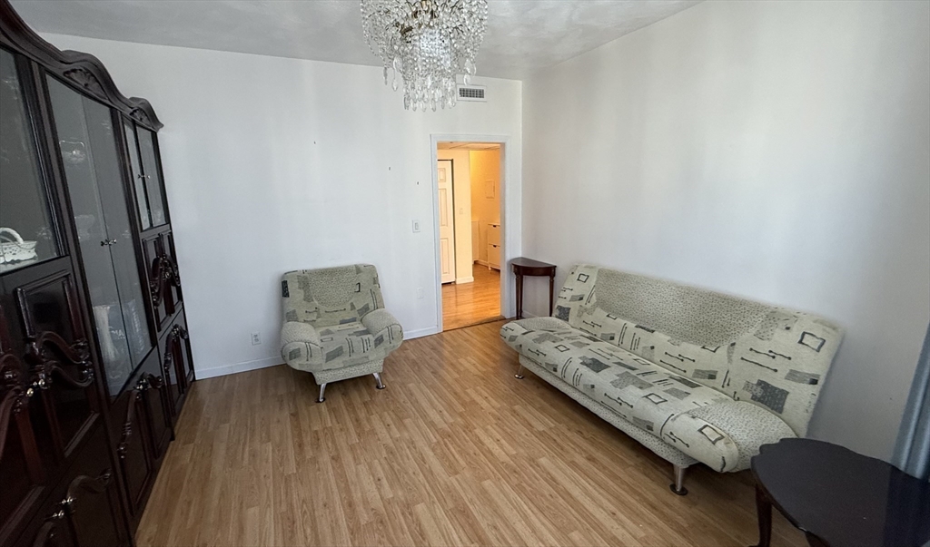 92 Gordon Street, Unit 301A Boston, MA 02135 - Photo 4 of 15 a living room with furniture and a window