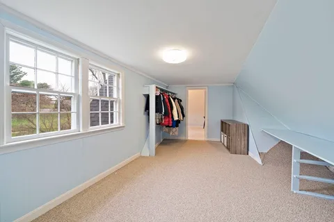 an entryway and livingroom with furniture