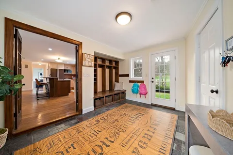 a room with lots of furniture and a rug