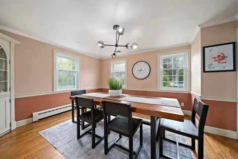 a view of a dining room and a table and chairs