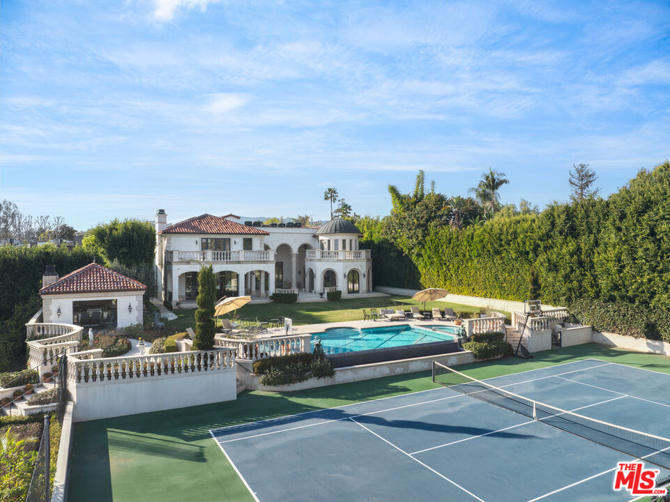 274 North Tigertail Road Los Angeles, CA 90049 - Photo 2 of 3 a view of a house with a garden and deck