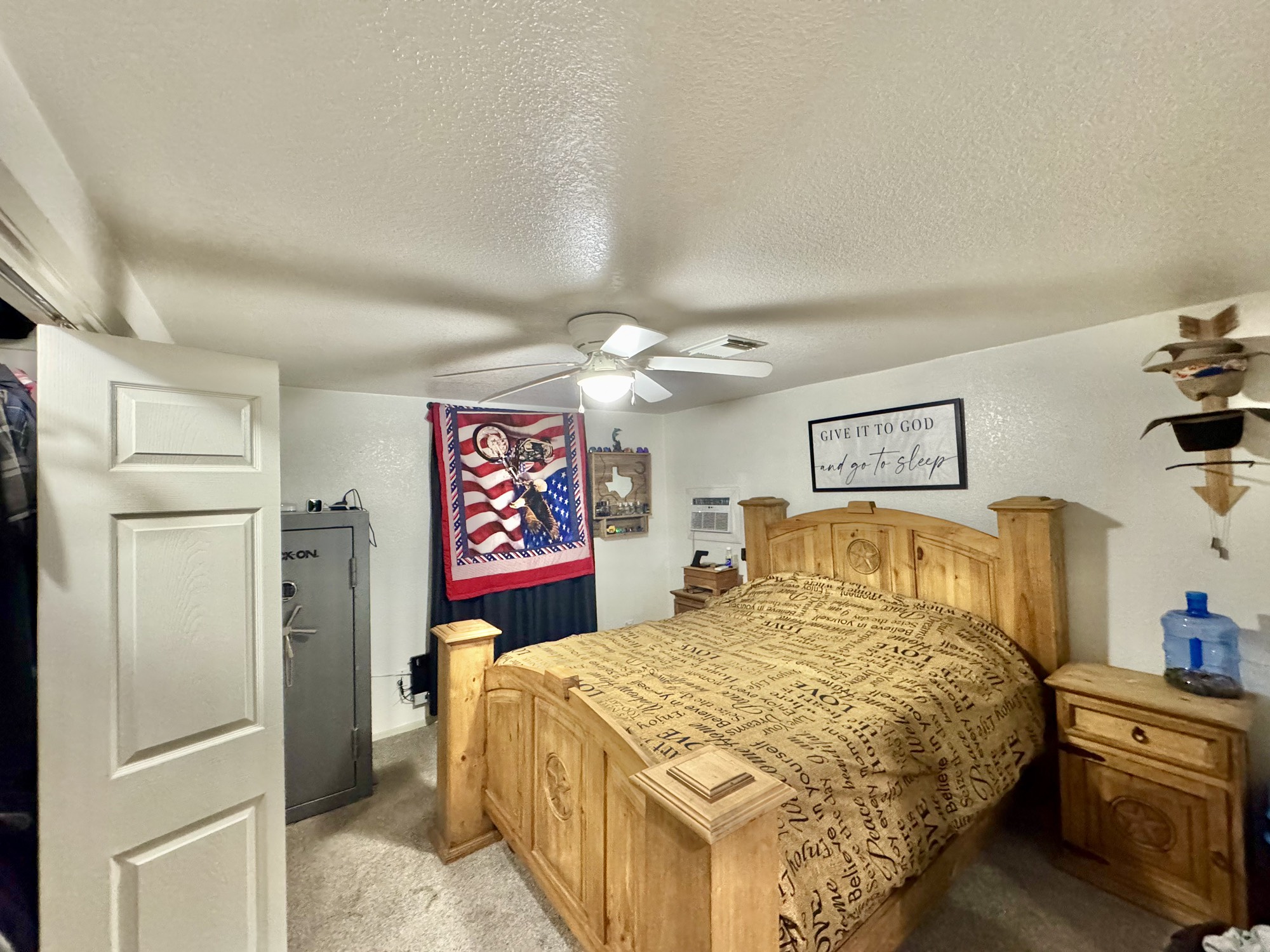11837 13th Street Santa Fe, TX 77510 - Photo 13 of 20 a bedroom with a bed and a chandelier