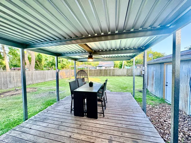 a view of a patio with wooden floor