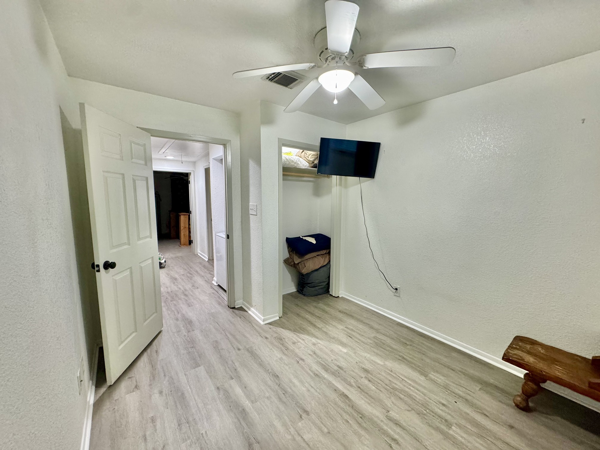 11837 13th Street Santa Fe, TX 77510 - Photo 9 of 20 wooden floor in an empty room with a window