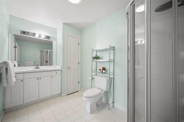 a living room with furniture and a ceiling fan