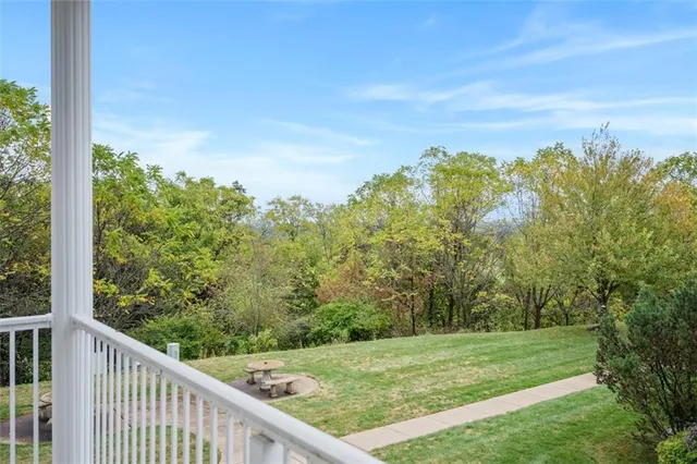 a view of multiple houses with yard street and slide