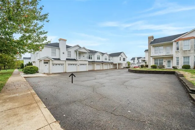 an aerial view of a house with lots of trees