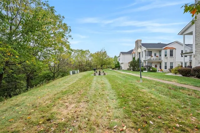 an aerial view of a house with a garden