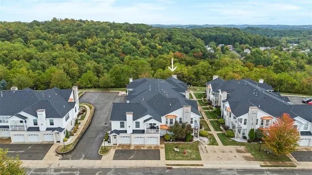 an aerial view of a house with a lake view