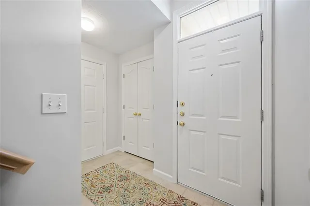 a view of a hallway with wooden shelves