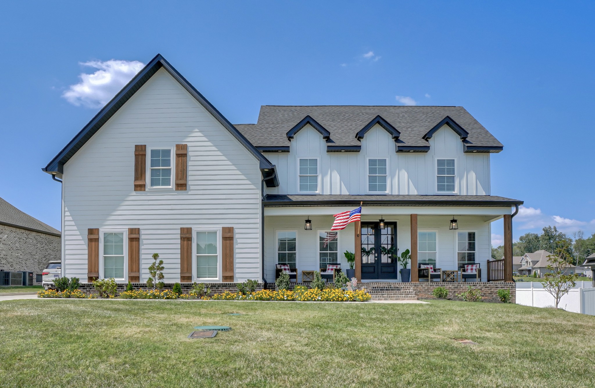 a front view of a house with a yard table and chairs