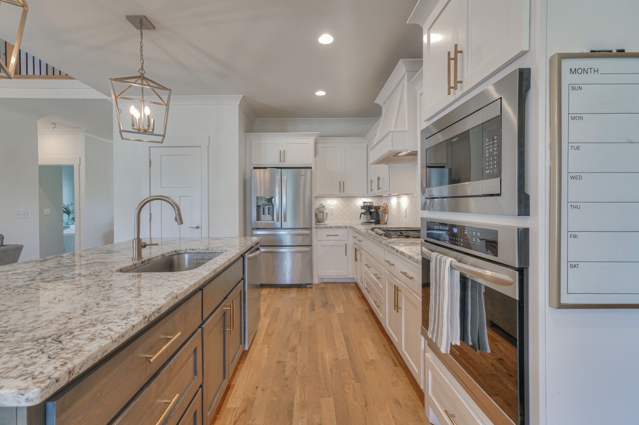7774 Santos Drive Murfreesboro, TN 37129 - Photo 11 of 42 a kitchen with stainless steel appliances granite countertop a sink dishwasher a stove and a refrigerator