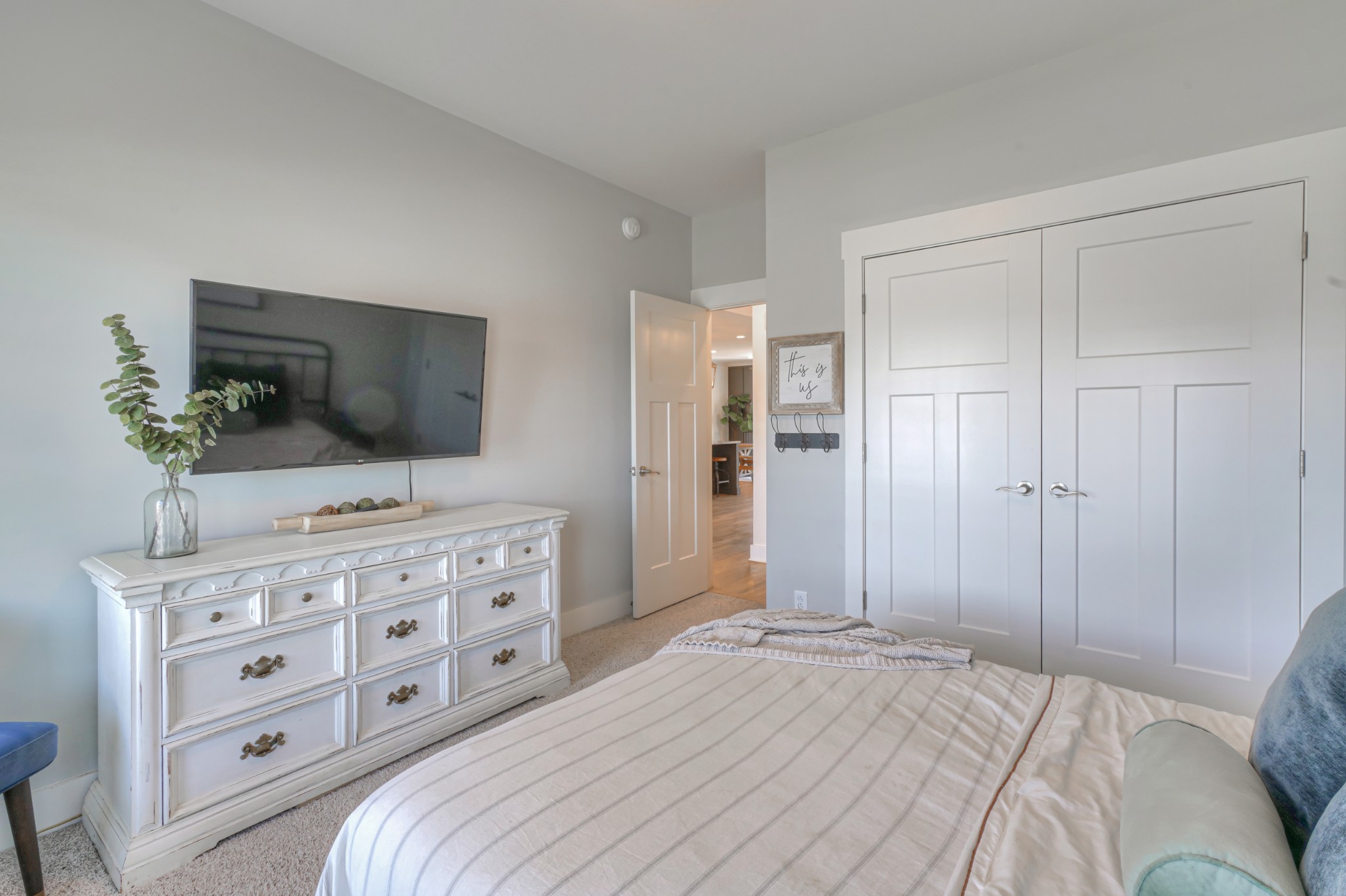 7774 Santos Drive Murfreesboro, TN 37129 - Photo 23 of 42 a bedroom with a bed and a flat tv screen on dresser