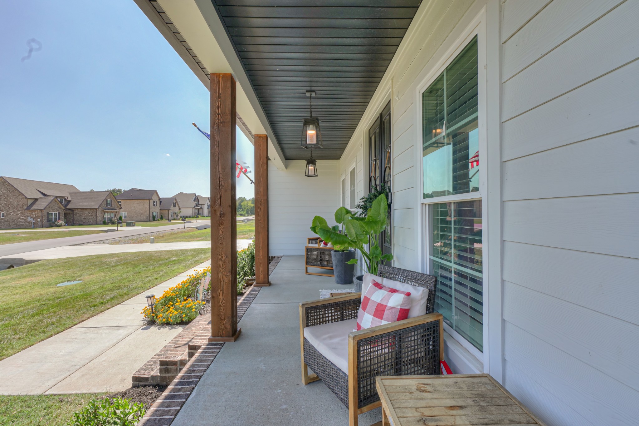 7774 Santos Drive Murfreesboro, TN 37129 - Photo 3 of 42 a balcony with furniture and a potted plant