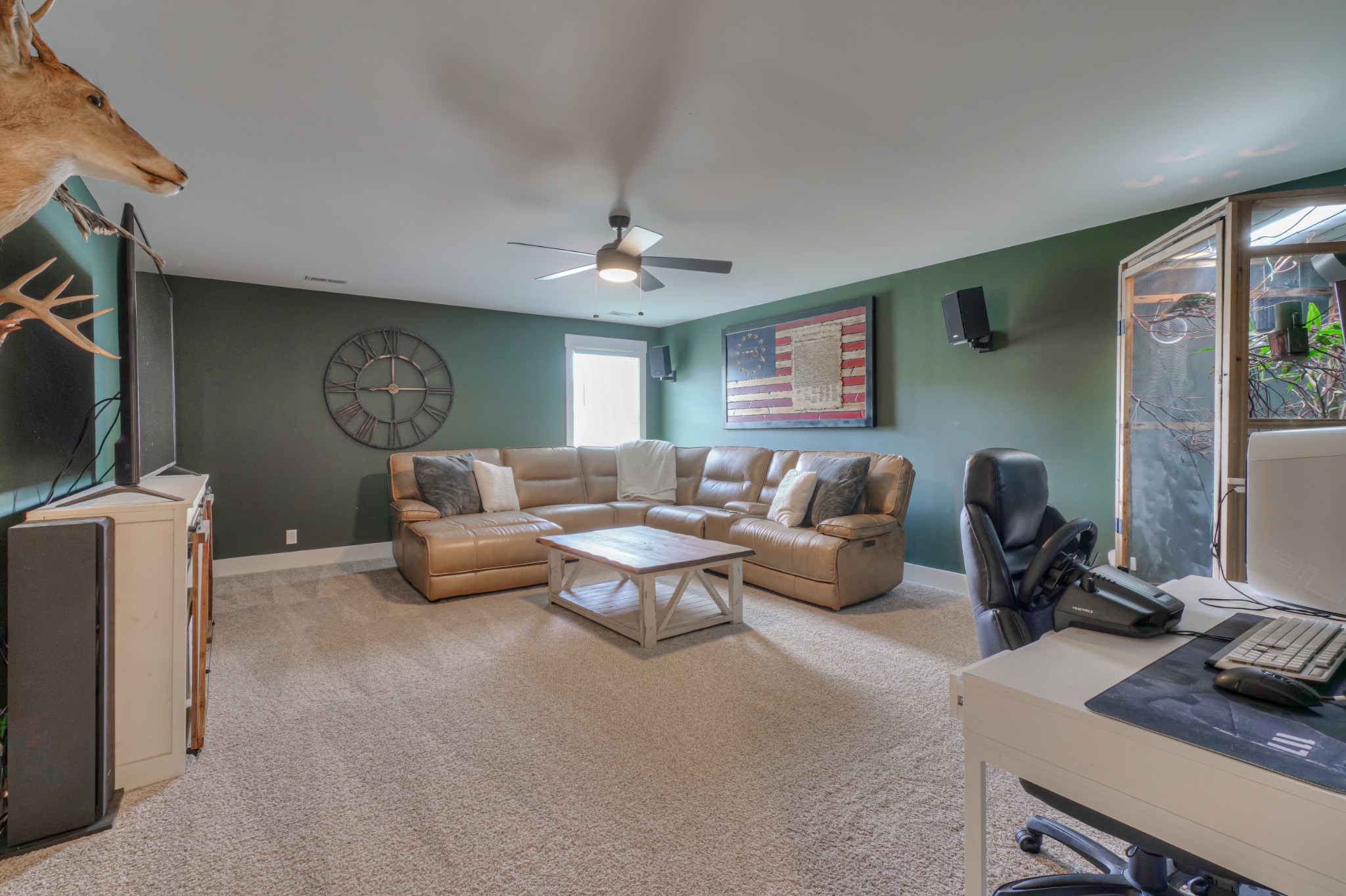 7774 Santos Drive Murfreesboro, TN 37129 - Photo 31 of 42 a living room with furniture and a flat screen tv