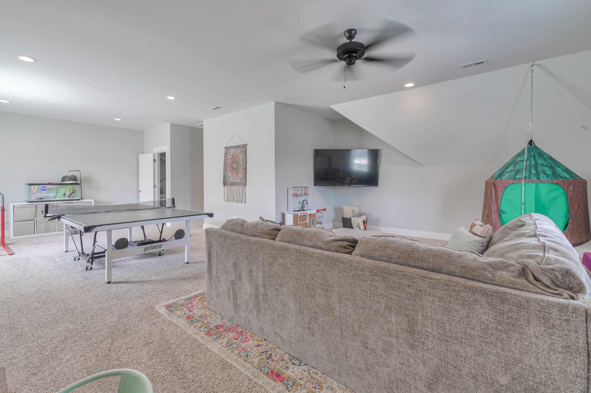 7774 Santos Drive Murfreesboro, TN 37129 - Photo 34 of 42 a living room with furniture and a flat screen tv
