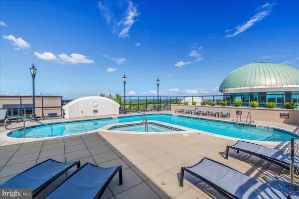 a view of a swimming pool with a patio