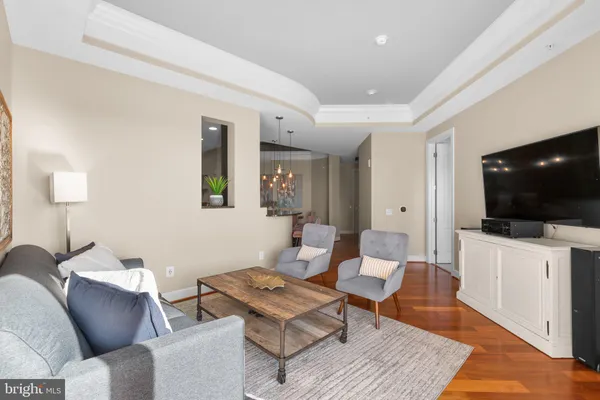 a dining room with furniture and wooden floor