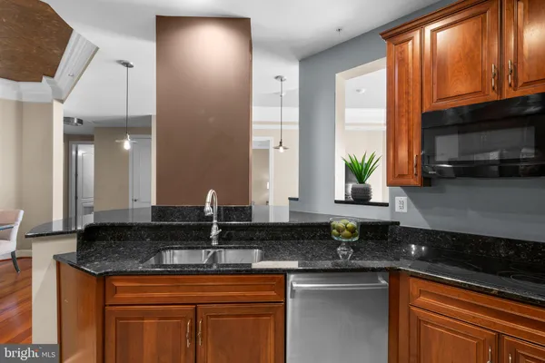 a kitchen with a refrigerator and a sink