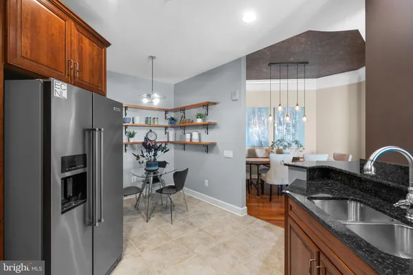 a view of kitchen with furniture and a potted plant