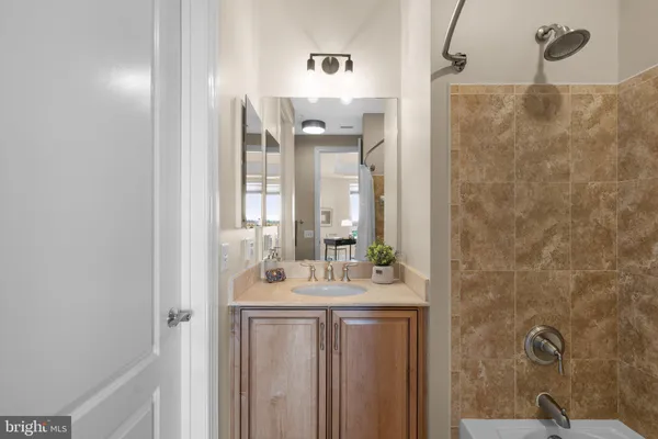 a bathroom with a shower and a sink
