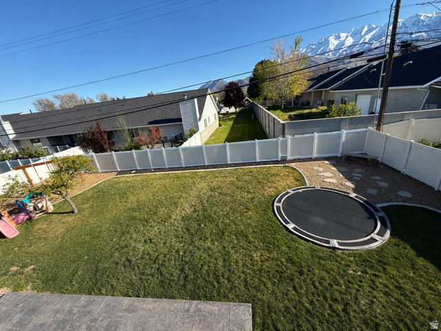 287 100 North Orem, UT 84057 - Photo 3 of 18 Fenced backyard with a trampoline