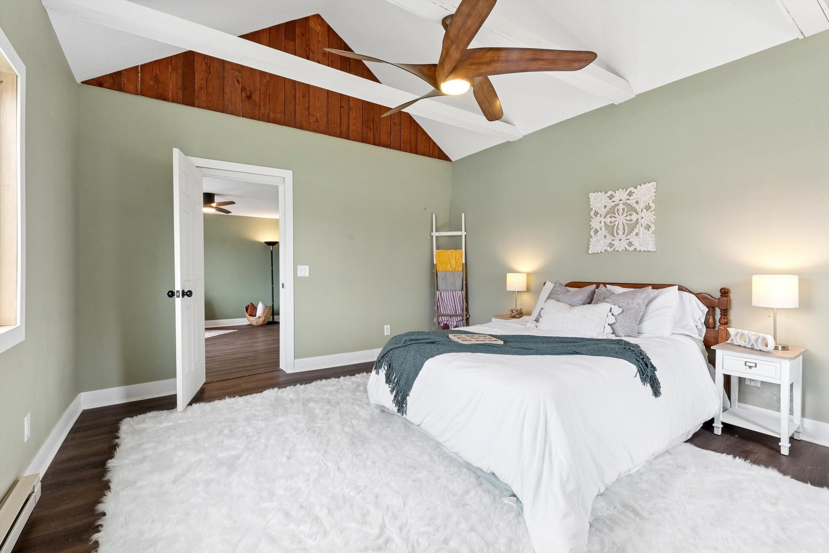 211 Clay Street New Boston, IL 61272 - Photo 17 of 29 a bedroom with a bed and a chandelier