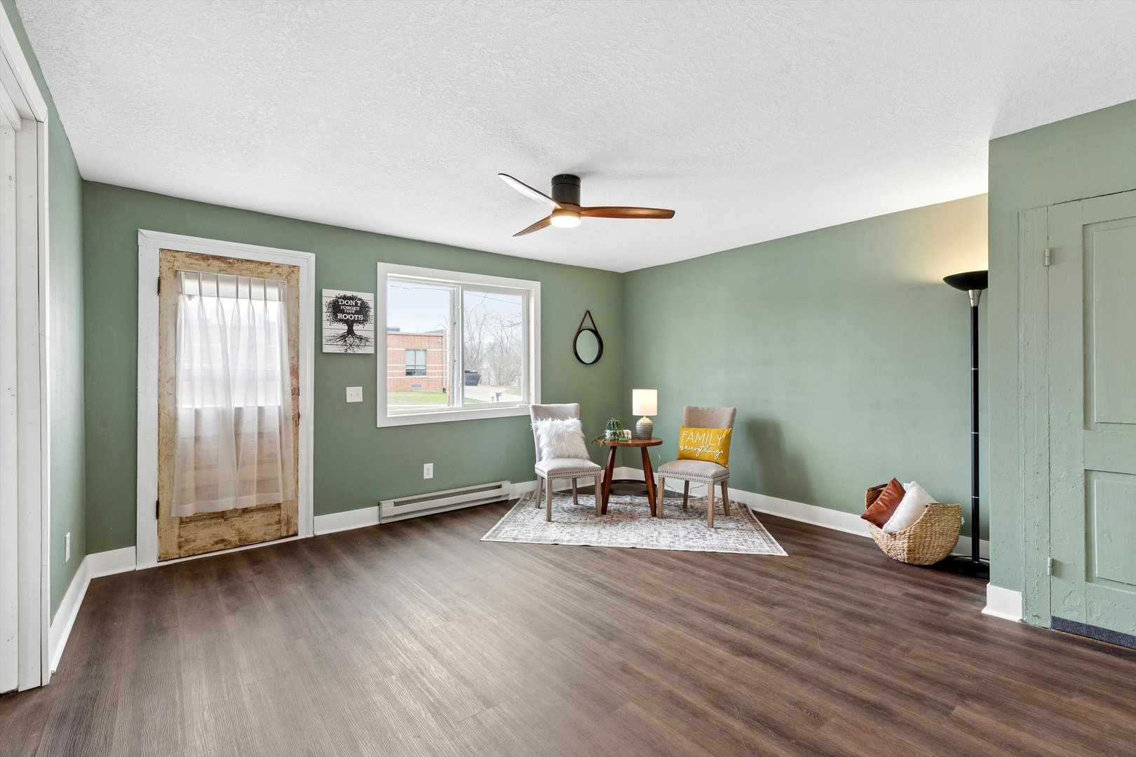 211 Clay Street New Boston, IL 61272 - Photo 2 of 29 a living room with furniture and wooden floor