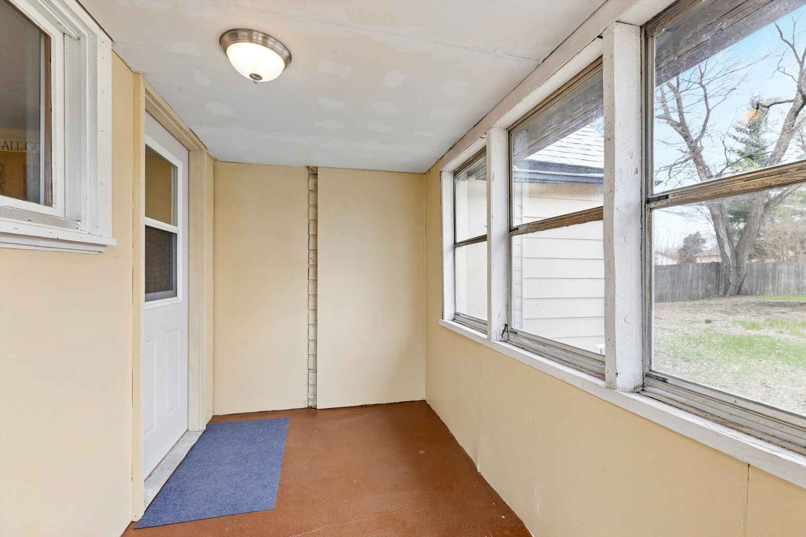 211 Clay Street New Boston, IL 61272 - Photo 26 of 29 a view of an empty room with wooden floor and a window