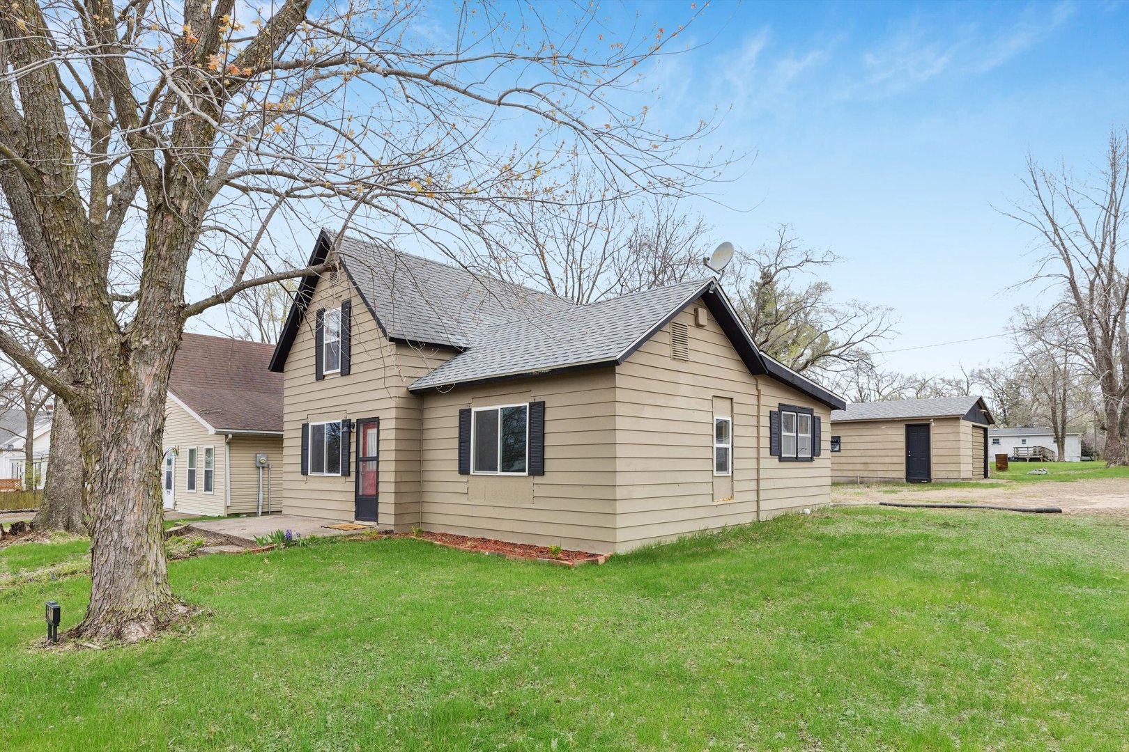 211 Clay Street New Boston, IL 61272 - Photo 29 of 29 a view of a yard in front of a house with large tree