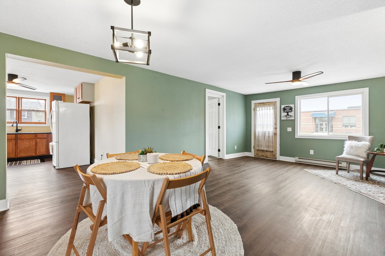211 Clay Street New Boston, IL 61272 - Photo 6 of 29 a view of a dining room with furniture window and wooden floor