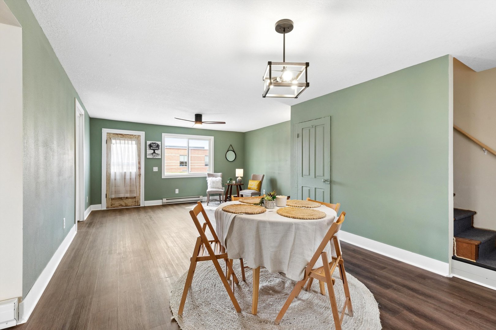 211 Clay Street New Boston, IL 61272 - Photo 7 of 29 a view of a dining room with furniture wooden floor and chandelier