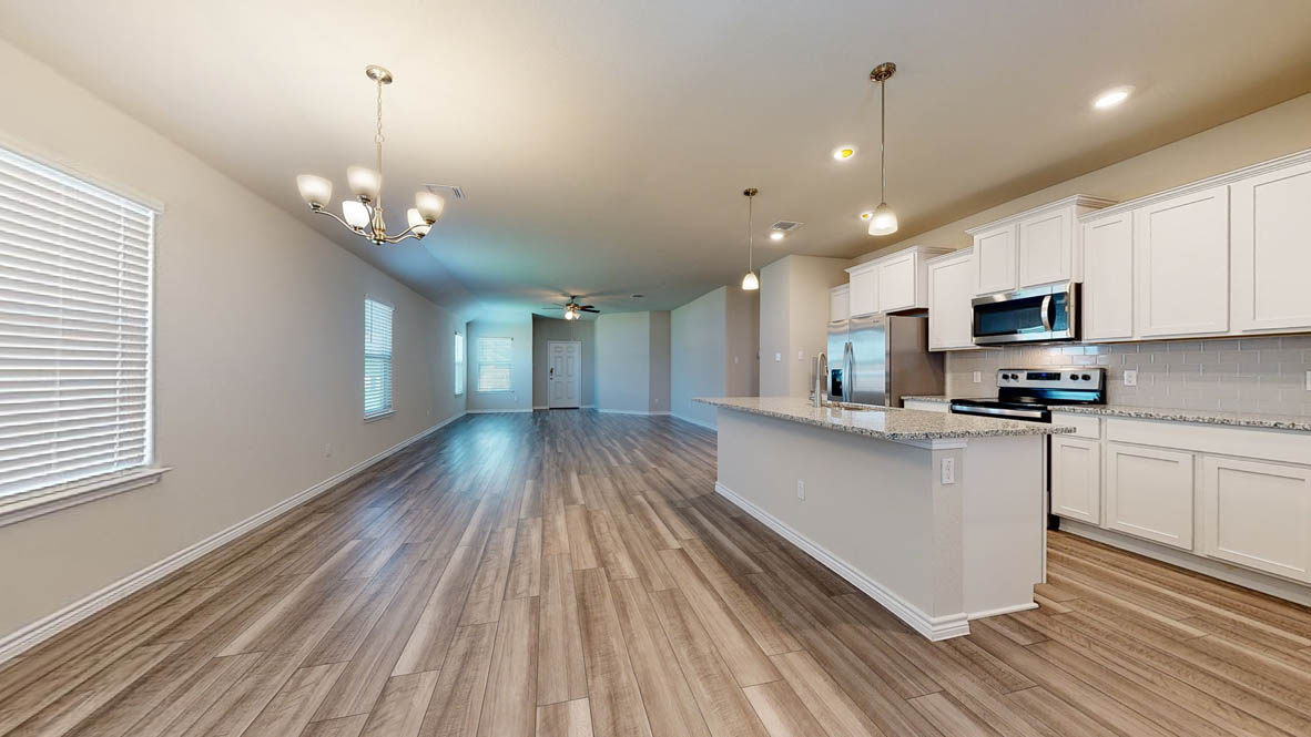 104 Kenzie Street Thorndale, TX 76577 - Photo 8 of 28 a view of a kitchen with microwave and stove