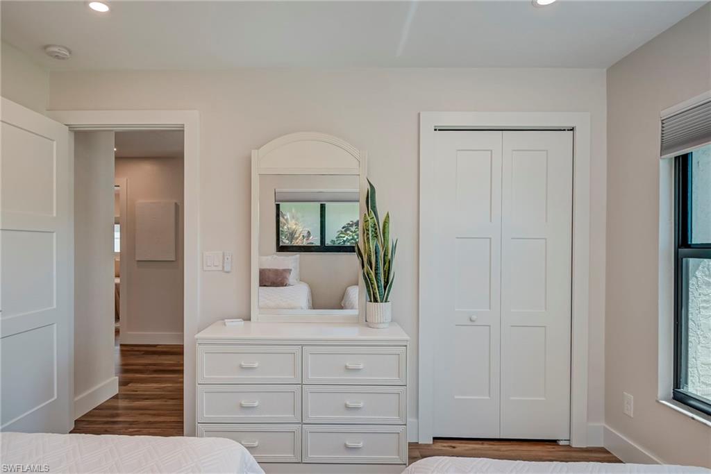 577 98th Avenue North Naples, FL 34108 - Photo 10 of 33 a bathroom with a mirror and a sink