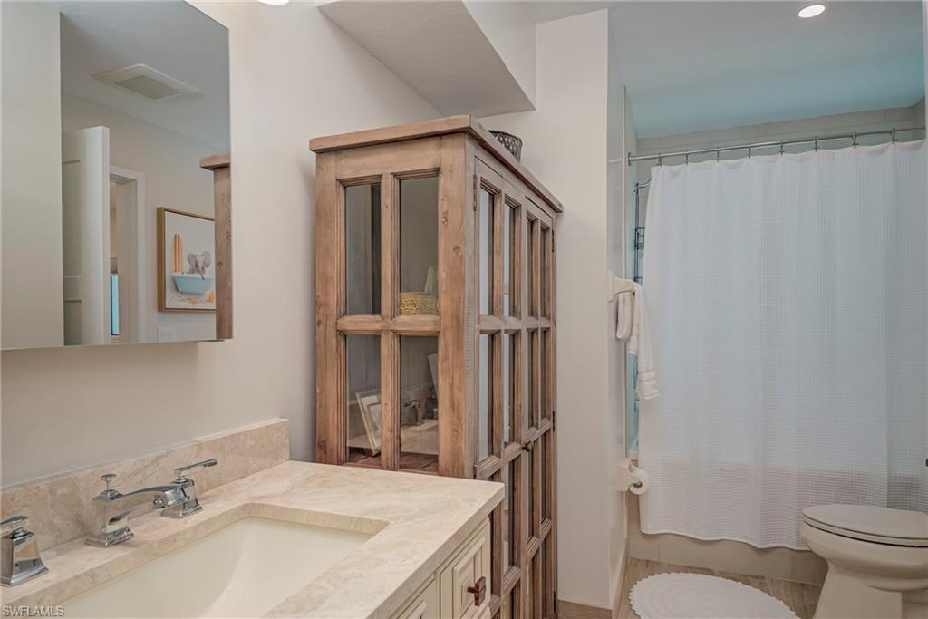 577 98th Avenue North Naples, FL 34108 - Photo 14 of 33 a bathroom with a sink toilet and shower