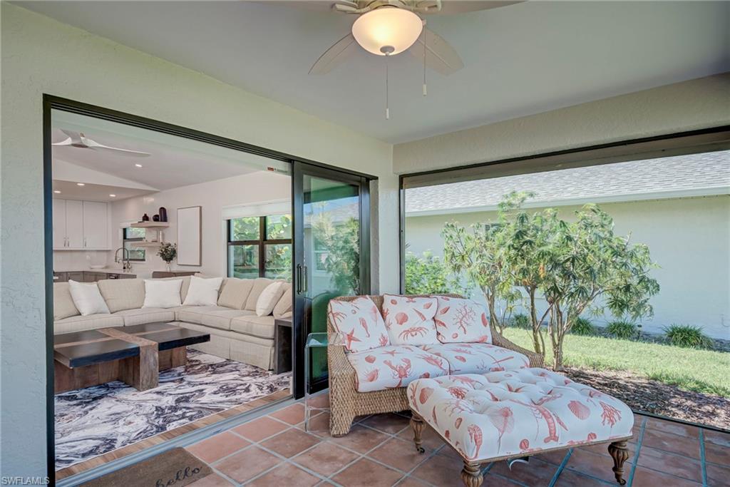 577 98th Avenue North Naples, FL 34108 - Photo 20 of 33 a living room with furniture and a large window