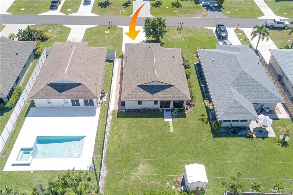 577 98th Avenue North Naples, FL 34108 - Photo 29 of 33 an aerial view of a house with swimming pool