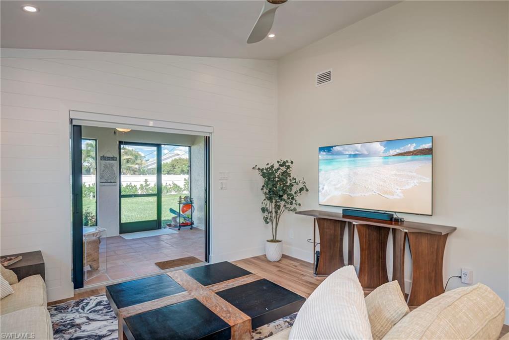 577 98th Avenue North Naples, FL 34108 - Photo 4 of 33 a living room with furniture and a window