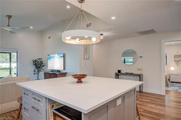 a kitchen with a stove a sink and a refrigerator