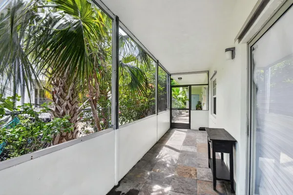 a view of a back yard from a balcony