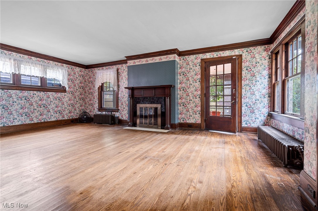 1271 Circle Drive Akron, OH 44310 - Photo 6 of 45 Crown molding, light wood finished floors, and a premium fireplace